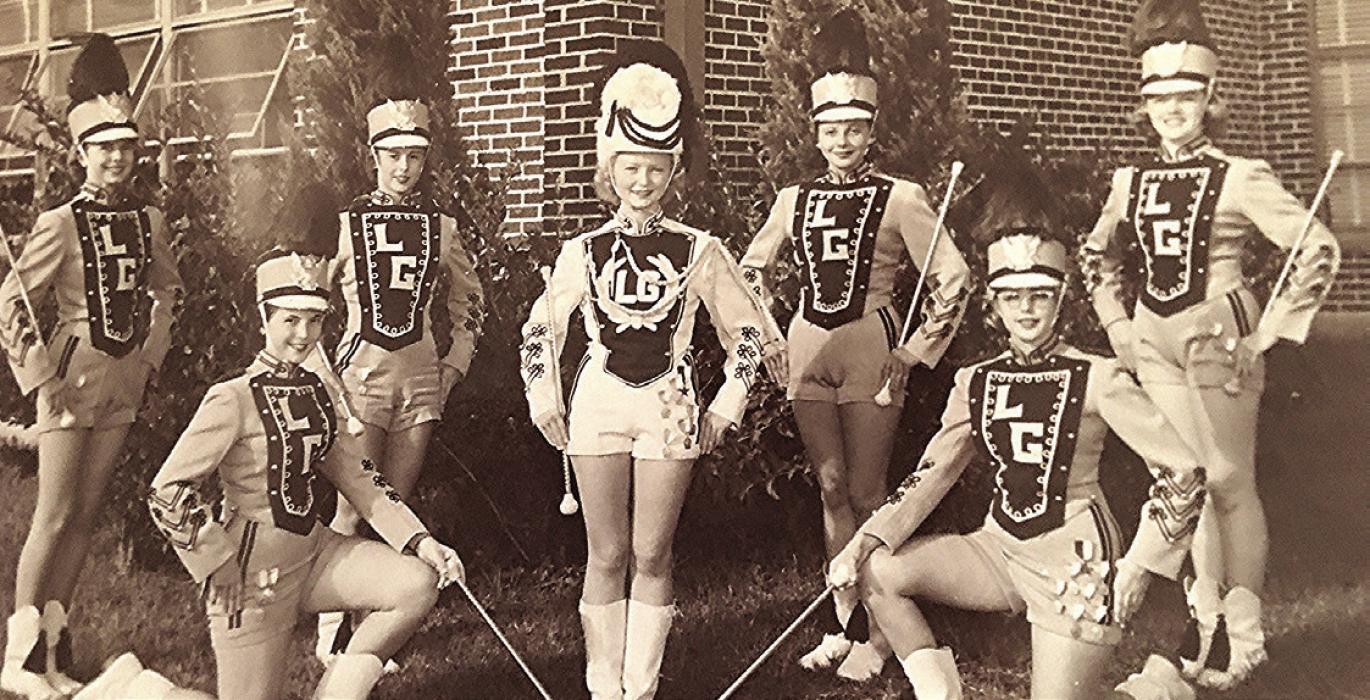 1955 La Grange Leopard band members (front row, left to right) are: Jean Foyt, drum major Virginia Mika Leech and Camille Freytag Roselius. (Back row, left to right): Elva Ann Meiners Keilers, Marilyn Jurajda Hart, Patsy Balzer Ott and Betty Mueller Schmidt.