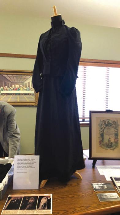 This black wedding dress, worn by Minna May Pillack in 1896, is representative of the black wedding gowns that Wendish brides wore when they married at Holy Cross Lutheran Church. The black wedding dress tradition continued until around 1910.
